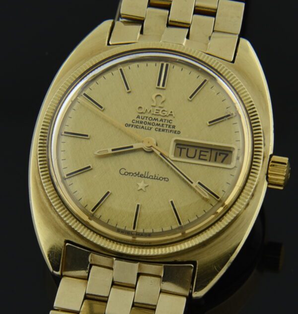 1970 Omega 35mm Constellation C 14k solid-gold watch with original case, winding crown, brick link bracelet, dial, and caliber 751 movement.