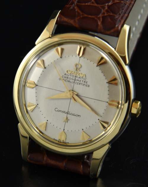 Omega Constellation gold-capped watch with original pie-pan dial, winding crown, kite markers, and chronometer-grade caliber 551 movement.