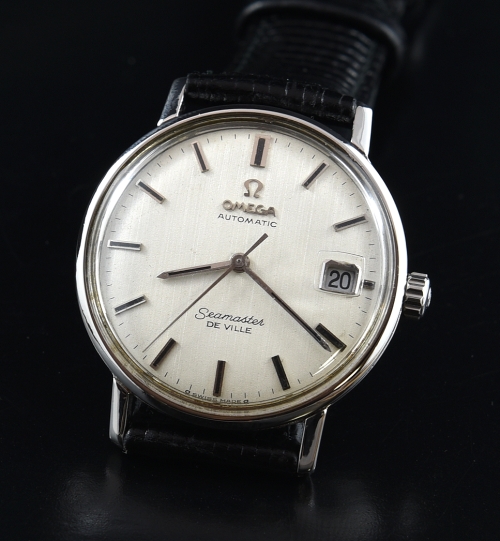 1960s Omega Seamaster De Ville stainless steel watch with original textured dial, crown, magnifier crystal, and caliber 500 series movement.