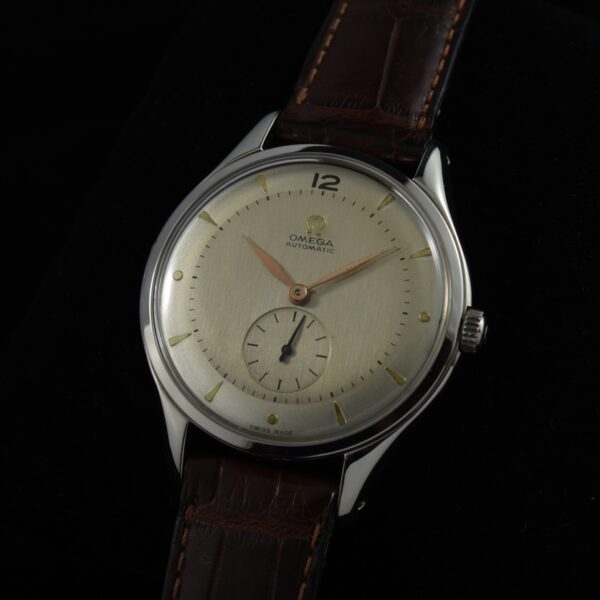 1951 Omega stainless steel jumbo watch with original restored dial, raised applied markers, case, and clean caliber 344 automatic movement.