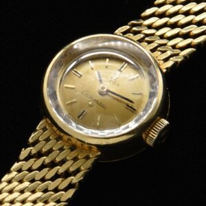 1965 Omega 18mm Ladymatic 18k solid-gold watch with serpentine bracelet, automatic winding caliber 661 movement, and solid-gold bracelet.