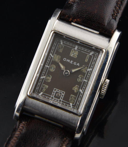 1941 Omega Marine De Luxe stainless steel watch with original case, mineral-glass crystal, restored dial, and T-17 manual winding movement.