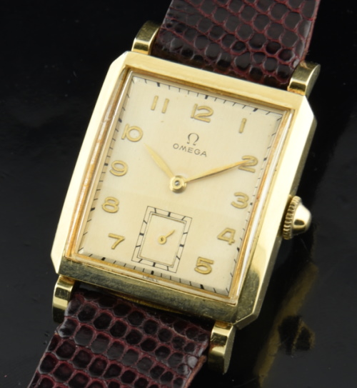 1946 Omega 38.5mm gold-filled dress watch with original case, Arabic numeral dial, dimple crown, and cleaned manual winding gilt movement.