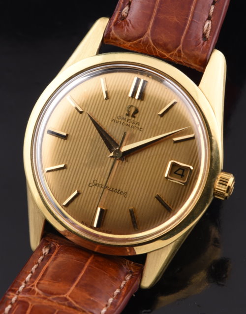 1960 Omega 33.5mm 18k solid-gold watch with original ribbed dial, Dauphine hands, case, and cleaned caliber 562 automatic winding movement.