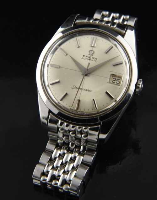 1966 Omega Seamaster stainless steel watch with original quadrant dial, Dauphine hands, beads-of-rice bracelet, and caliber 562 movement.
