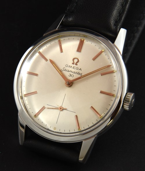 1962 Omega 35mm Seamaster 30 stainless steel watch with original case, crown, hesalite crystal, dial, and fine caliber 269 manual movement.