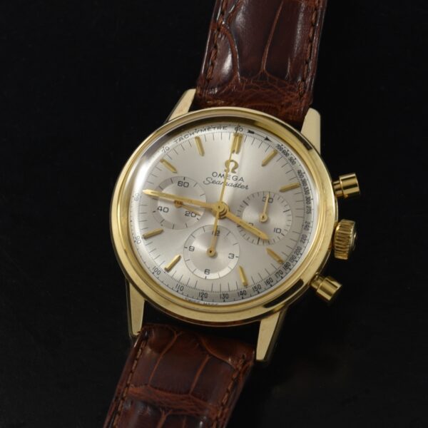 1963 Omega 35mm 14k gold chronograph watch with caliber 321 manual winding movement, the original dial, and Vacheron Constantin Cousu band.