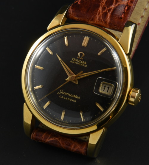 1956 Omega Seamaster Calendar gold-plated watch with original black dial, Dauphine hands, case, and caliber 503 automatic winding movement.