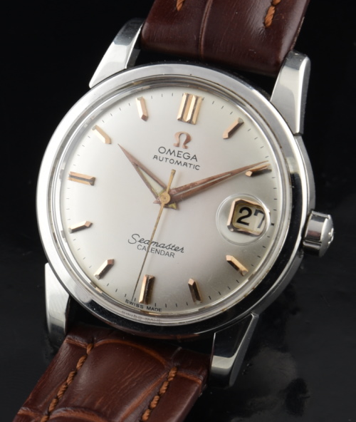 1960 Omega 34mm Seamaster Calendar stainless steel watch with original crystal, crown, dial, hands, case, and automatic winding movement.