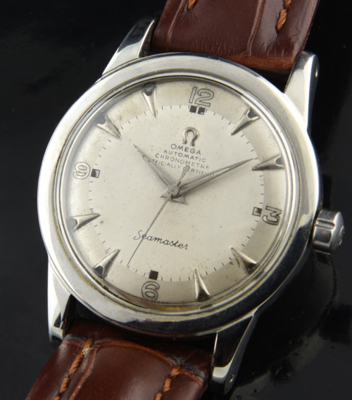 1950 Omega 34mm Seamaster stainless steel watch with original dial, numerals, and caliber 352 bumper automatic chronometer-grade movement.