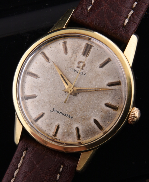 1960 Omega 35mm Seamaster gold-capped watch with original steel case, sea monster logo, dial, Dauphine hands, and fine caliber 265 movement.