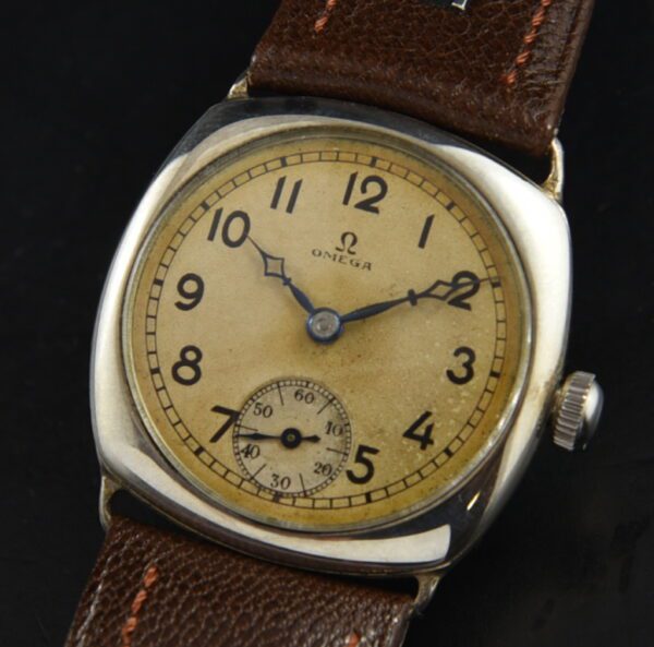 1932 cushion-shaped Omega 30.5mm sterling silver watch with original signed case, restored dial, and manual movement with two adjustments.