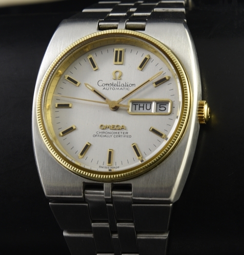 1972 Omega Constellation stainless steel watch with original 14k gold bezel, crown, silver dial, day/date feature, and automatic movement.