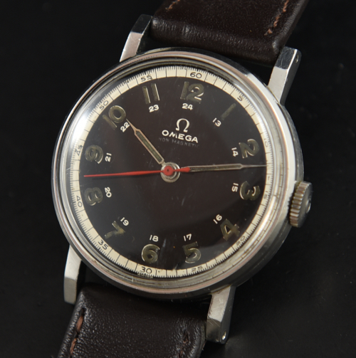1942 Omega 32.5mm WW2-era stainless steel military watch with original black dial, case, angled lugs, and manual winding 30T2SC movement.