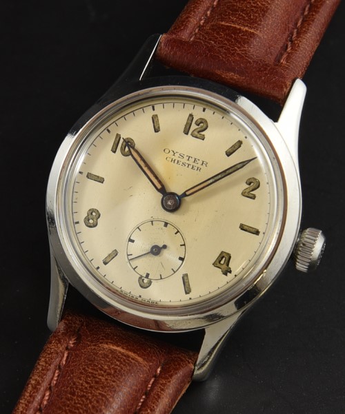1947 Rolex 31mm Oyster Chester stainless steel watch with original patented winding crown, dial, pencil hands, and manual winding movement.