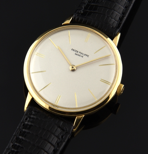 1968 Patek Philippe Calatrava 18k gold watch with original narrow bezel, winding crown, restored dial, and caliber 23-300 manual movement.