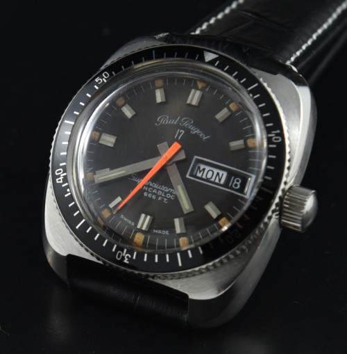 1970s Paul Peugeot 36mm Surf n' Ski stainless steel dive watch with original dial, hands, 200m depth, and Swiss automatic movement.