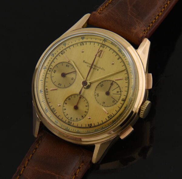 1950s Record 38mm 18k rose gold chronograph watch with original case, beveled lugs, bezel, champagne dial, and famous Venus 175 movement.