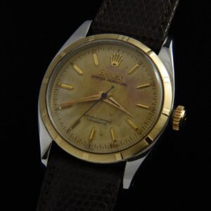 1954 Rolex stainless steel watch with original 14k gold bezel, Dauphine hands, dial, and serviced butterfly rotor caliber 1030 movement.
