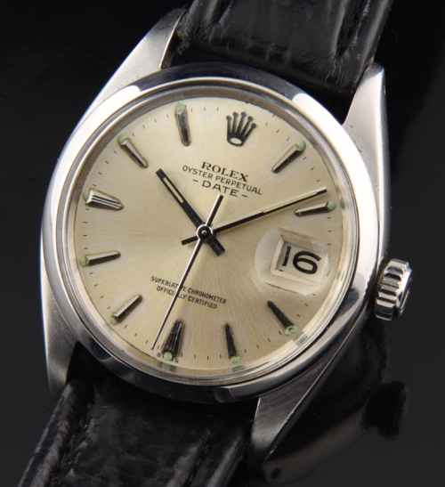 1961 Rolex Oyster Perpetual Date stainless steel watch with original dial, arrow markers, baton hands, and clean automatic winding movement.