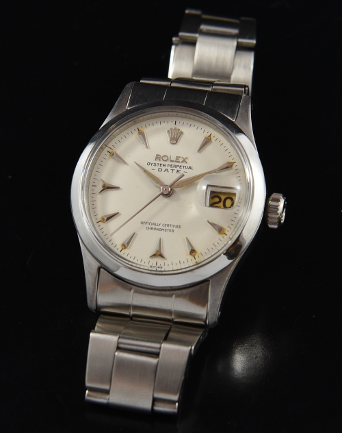 1956 Rolex Oyster Perpetual Date stainless steel watch with original hands, dial, Delta-style markers, and caliber 1030 automatic movement.