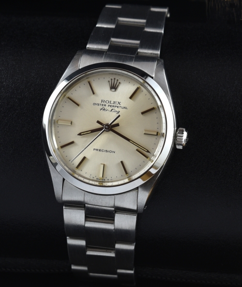 1982 Rolex Air-King stainless steel watch with original case, Oyster bracelet, silver dial, baton markers, and automatic winding movement.
