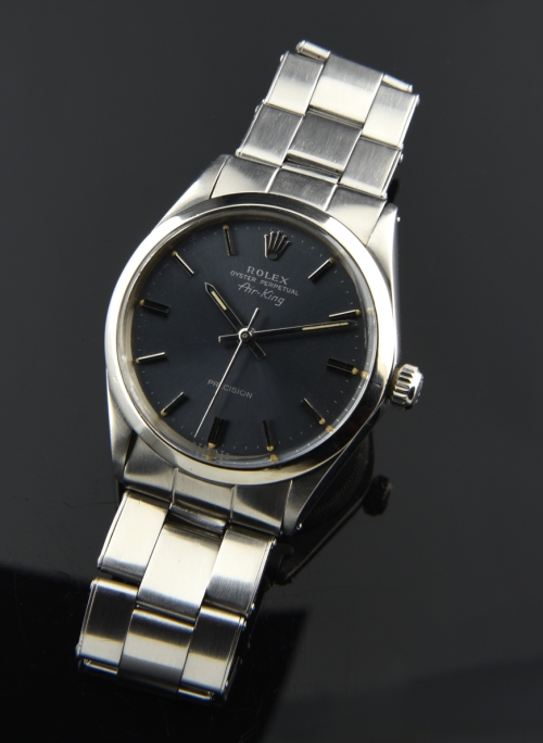 1969 Rolex Oyster Perpetual Air-King stainless steel watch with original slate dial, raised baton markers, hands, and automatic movement.