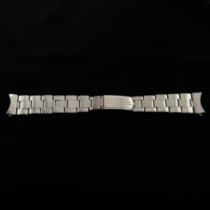 1964 Rolex Oyster 19mm wide stainless steel riveted bracelet with 60 end pieces and measuring 6.5" long. This band is tight for its age.