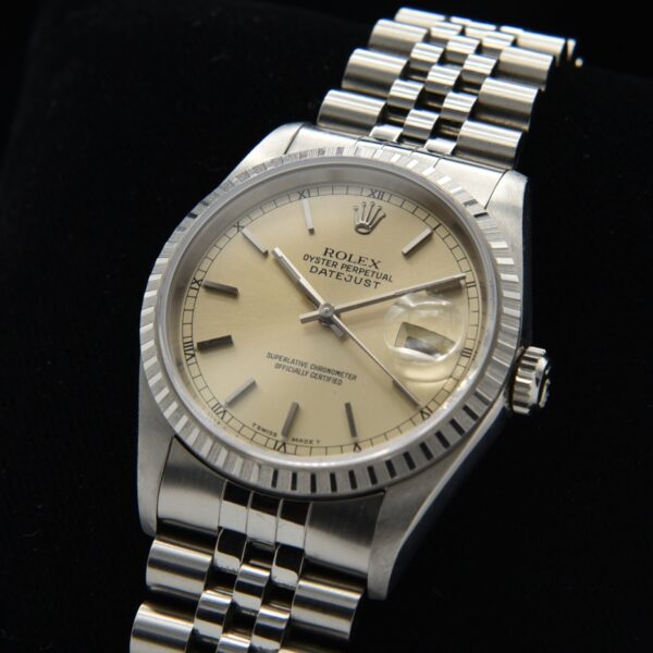 1995 Rolex 36mm Datejust stainless steel watch with original dial, tight Jubilee bracelet, automatic movement, and original box and papers.