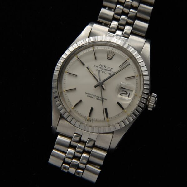 1977 Rolex 36mm 'Snow White' Datejust stainless steel watch wtih original box, papers, service receipts, Jubilee bracelet, and white dial.