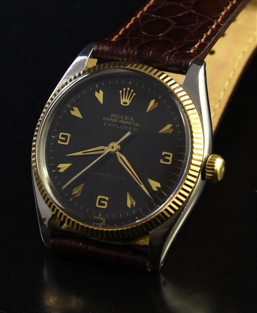 1963 Rolex Explorer Super Precision stainless steel watch with original 14k gold bezel, crown, dial, and caliber 1030 butterfly movement.