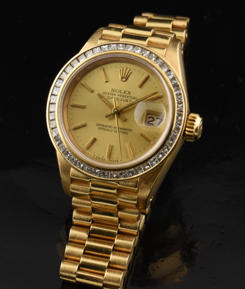 1982 Rolex 26.5mm President 18k solid-gold ladies watch with original case, Oyster bracelet, high-quality diamonds, and automatic movement.