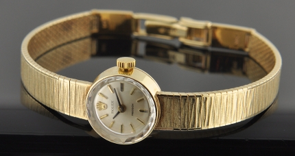 Rolex 14k solid-gold ladies watch with original dial, markers, coronet, faceted crystal, clasp, case, and cleaned manual winding movement.