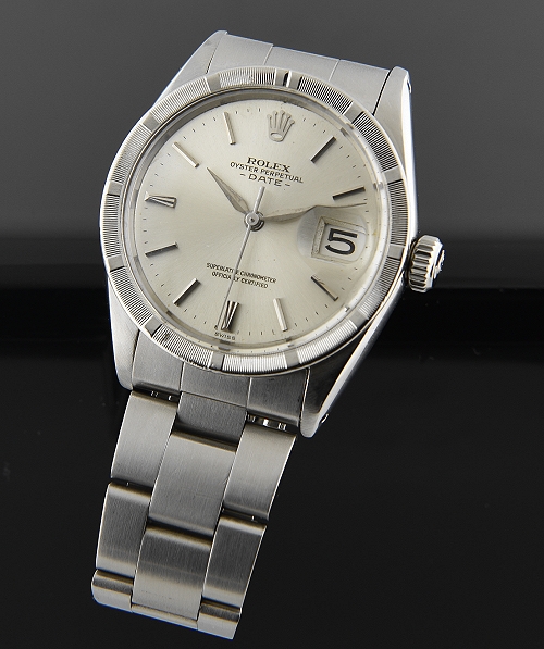 1963 Rolex Oyster Perpetual Date stainless steel watch with original Dauphine hands, bezel, markers, dial, and automatic winding movement.