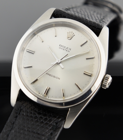 1965 Rolex Oyster stainless steel oversized watch with original silver dial, baton hands, and cleaned, accurate manual winding movement.