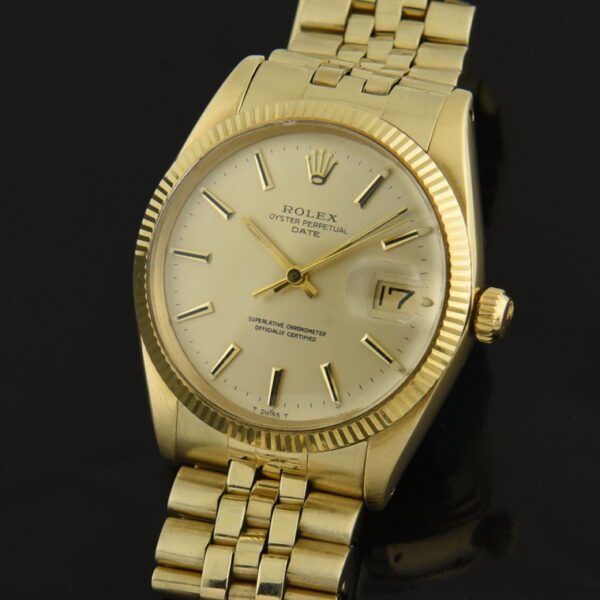 1974 Rolex 34mm Oyster Perpetual Date 14k gold watch with original case, Jubilee bracelet, box, papers, and caliber 1570 automatic movement.