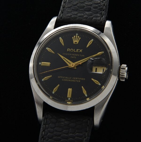 1957 Rolex 34mm Oyster Perpetual Date stainless steel watch with restored dial, original Dauphine hands, case, and caliber 1030 movement.