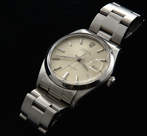 1970 vintage Rolex 34mm Oysterdate stainless steel watch with original clean dial, case, thick link bracelet, and manual winding movement.