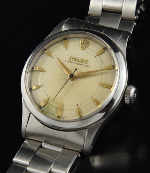 1954 Rolex 34mm Oyster Perpetual stainless steel watch with original riveted bracelet, sunken dial, brevet crown, and automatic NA movement.