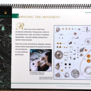 16-page laminated Rolex service book that was only given to dealers. It is lushly photographed explaining the process of a Rolex servicing.