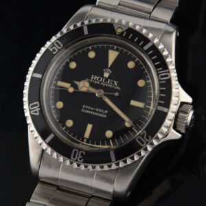 1962 Rolex Submariner stainless steel watch with original gilt exclamation dial, pointed crown, bezel, replaced bracelet, and polished case.