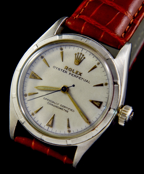 1951 Rolex Oyster Perpetual stainless steel watch with original restored dial, triangular markers, pencil hands, and NA automatic movement.