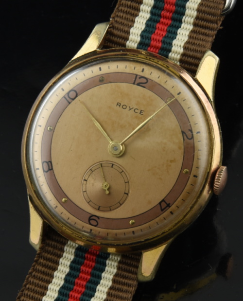 1940s Royce 34.75mm gold-plated WW2-era watch with original case, two-toned dial, thin handset, bezel, and cleaned manual winding movement.