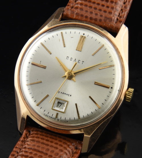 1960s Russian 34mm 14k solid-rose-gold watch with original beveled lugs, dial, hands, and cleaned, accurate automatic winding movement.