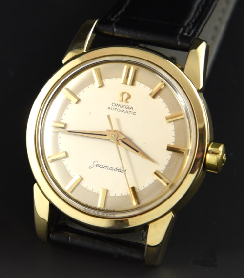 1955 Omega Seamaster stainless steel watch with original gold-capped case, two-toned dial, Dauphine hands, and cleaned caliber 501 movement.