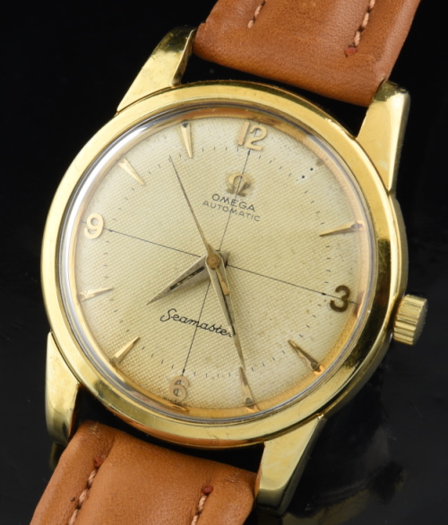 1956 Omega Seamaster gold-capped watch with orginal crosshair-textured dial, and cleaned 20-jewel caliber 501 full rotor automatic movement.
