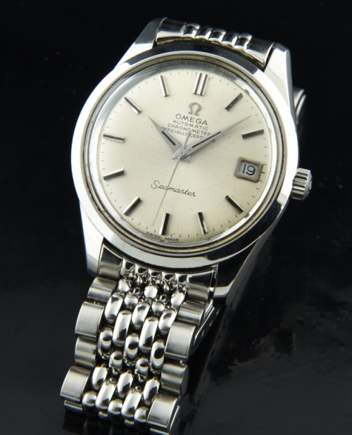 1969 Omega 35mm Seamaster stainless steel watch with original dial, beads-of-rice bracelet, and clean chronometer-grade automatic movement.