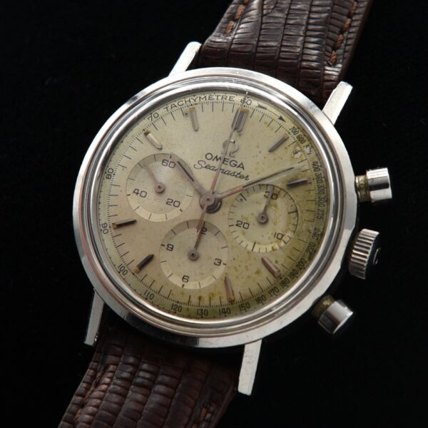 1965 Omega 35mm Seamaster stainless steel chronograph watch with original protruding pushers, dial, hands, buckle, and caliber 321 movement.