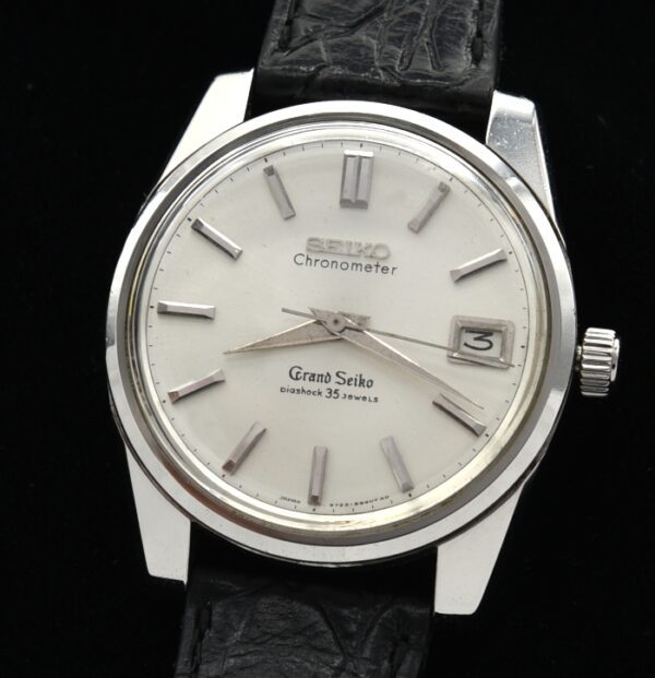 1960s Grand Seiko stainless steel watch with original crown, clean dial, hands, newer band/buckle, and serviced chronometer-grade movement.