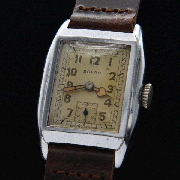 1940s Solar 25x36.5mm stainless steel watch with original dial, heart-shaped hands, Swiss 17-jewel movement. Made for Eaton's department.